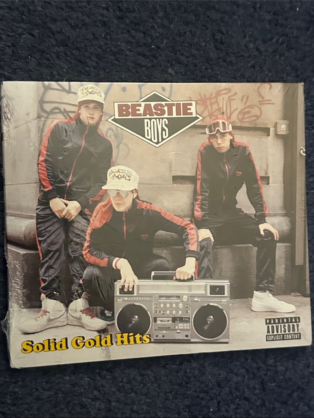 Beastie Boys "Solid Gold Hits" Album Cover - Beige, Black, Red